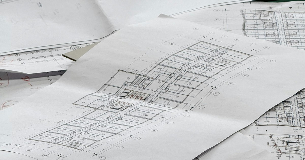 Architectural blueprints spread out on a table